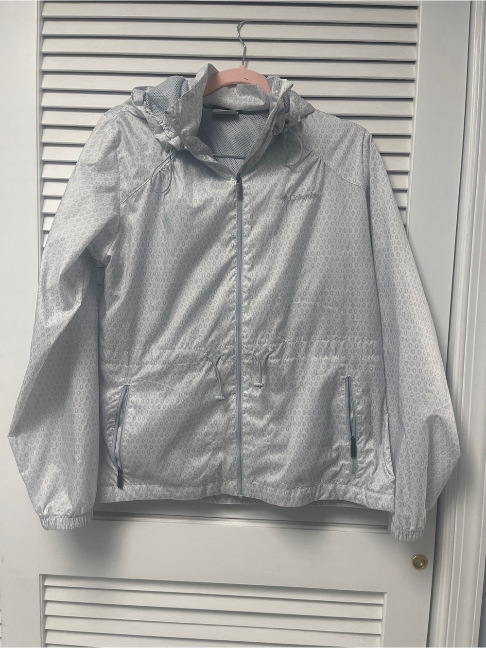 Columbia Light Gray Women’s Windbreaker with hood.